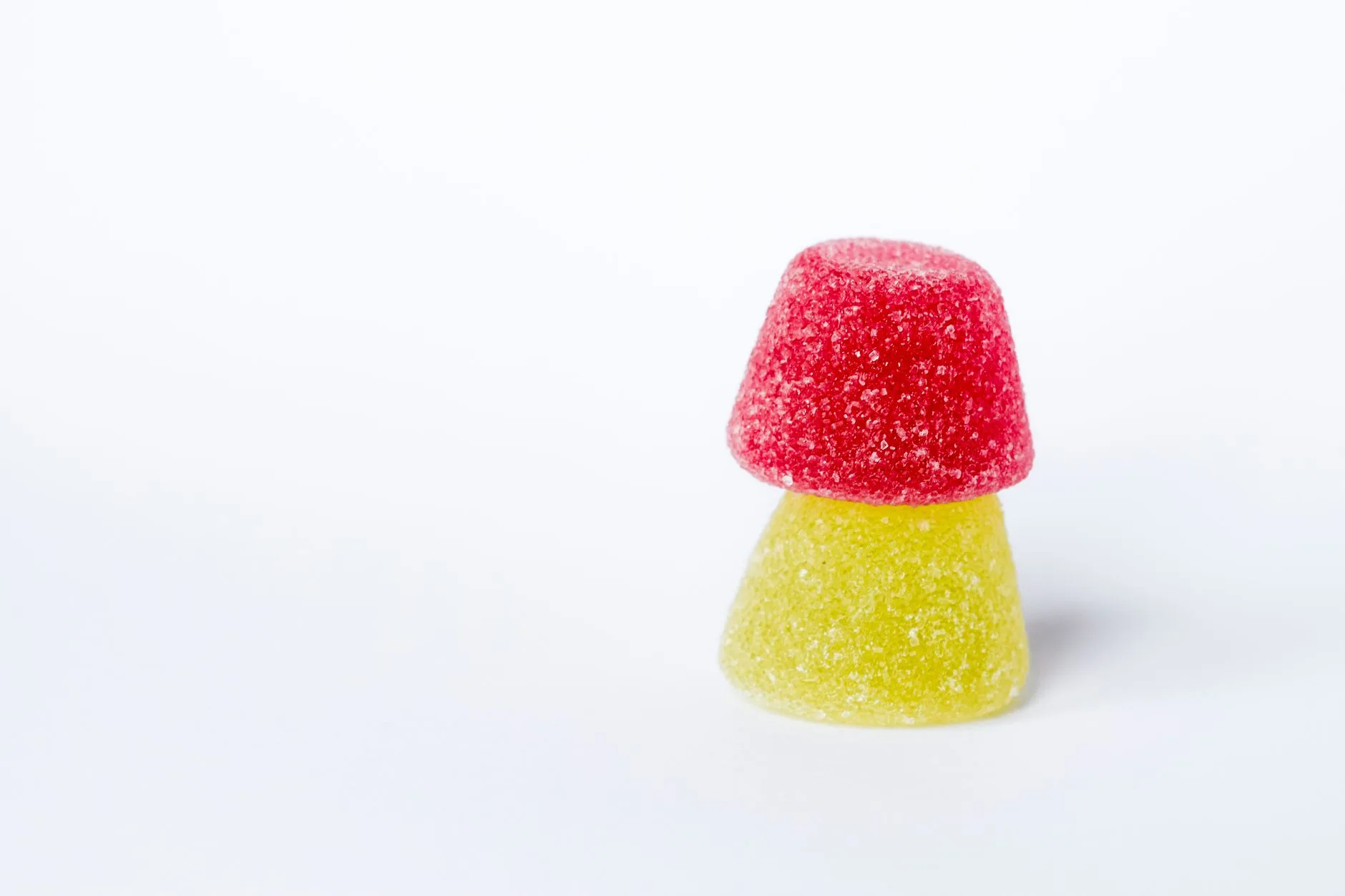 colorful fruit gummies on white background