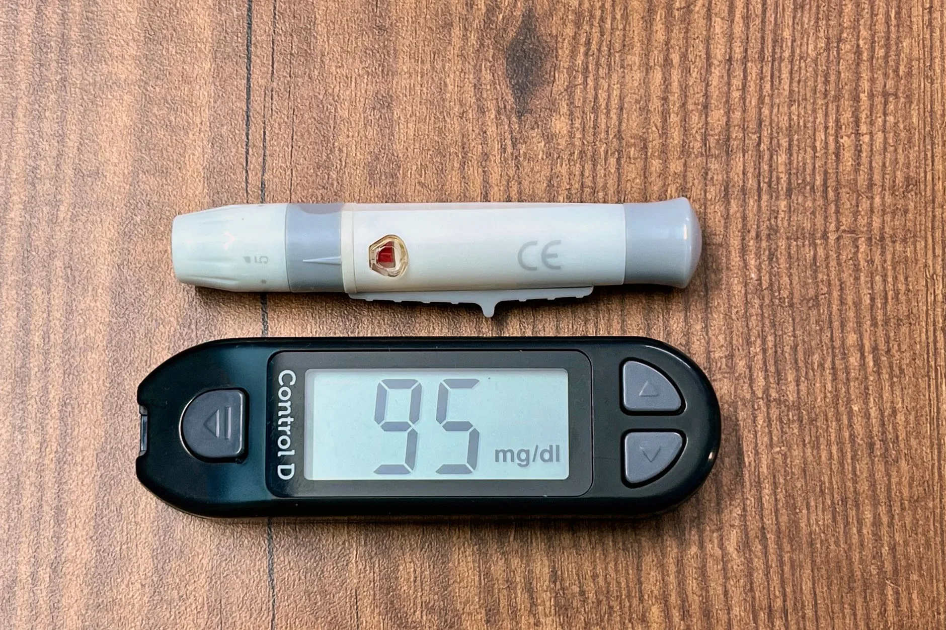 glucose meter showing normal blood sugar reading