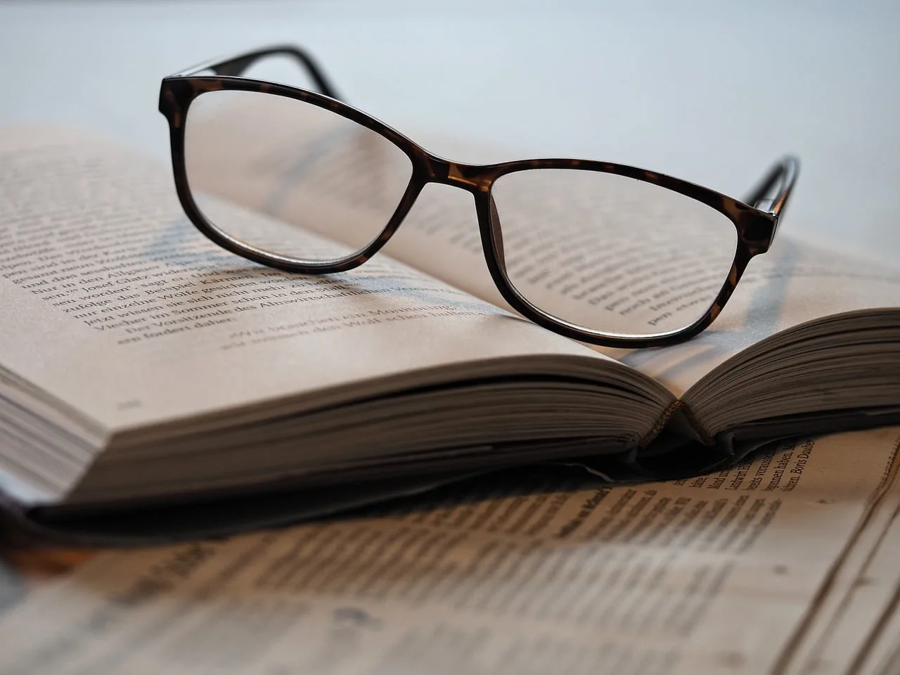 senior adult reading a book with clear focus