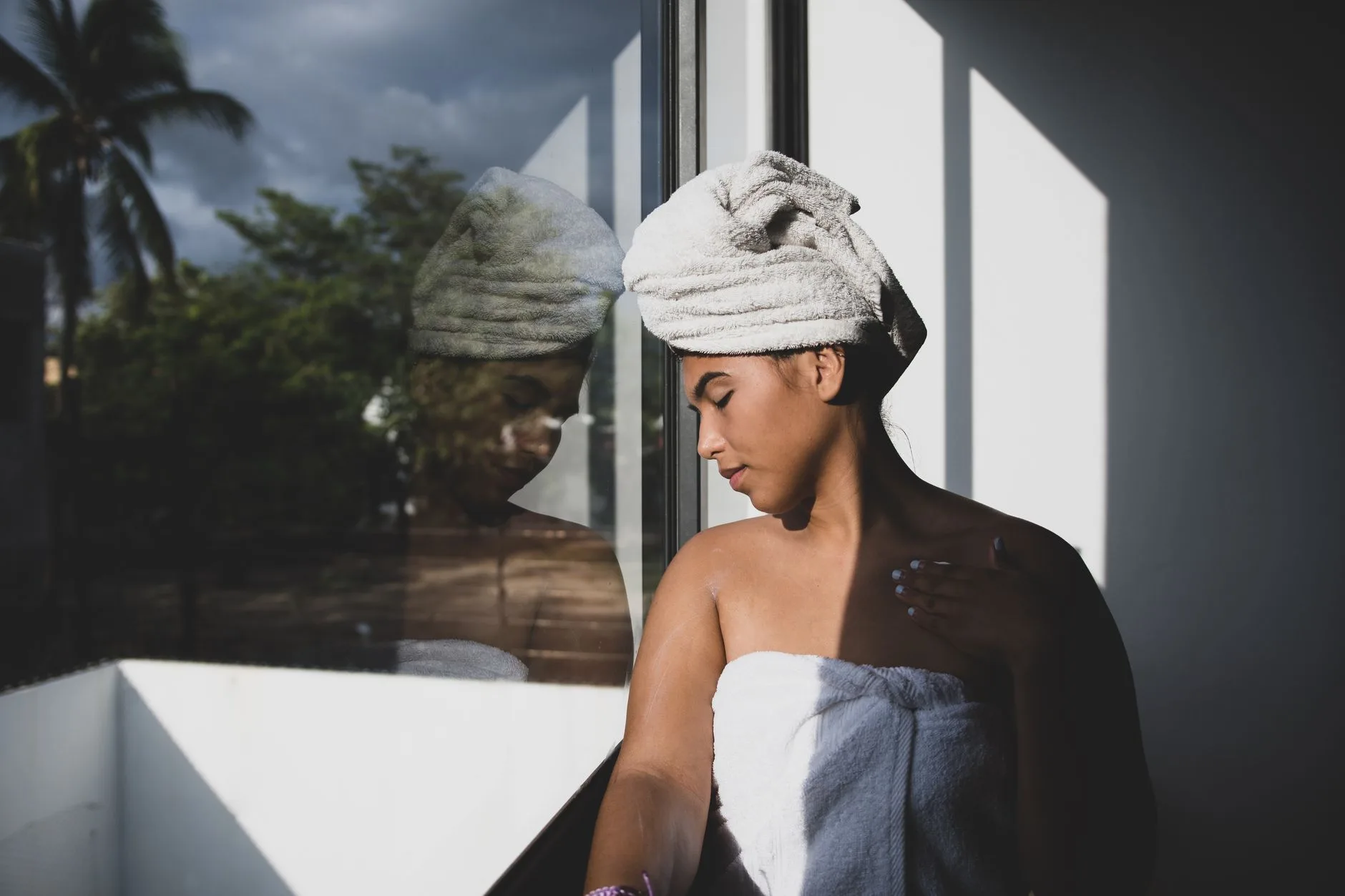 person wrapping in towel after cold plunge