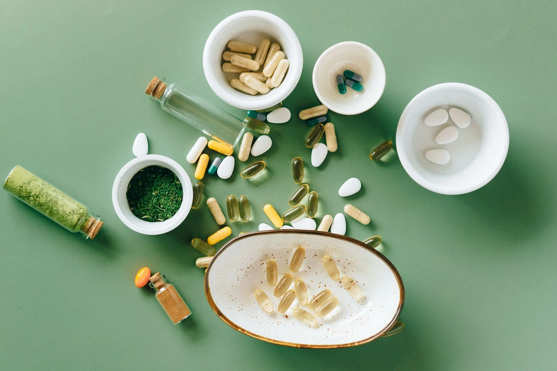 flat lay natural supplement ingredients cinnamon herbs