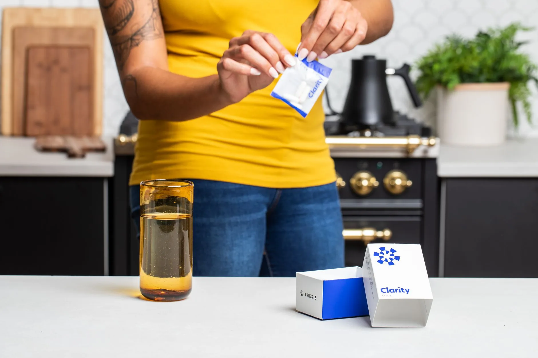 woman drinking water with supplement before meal