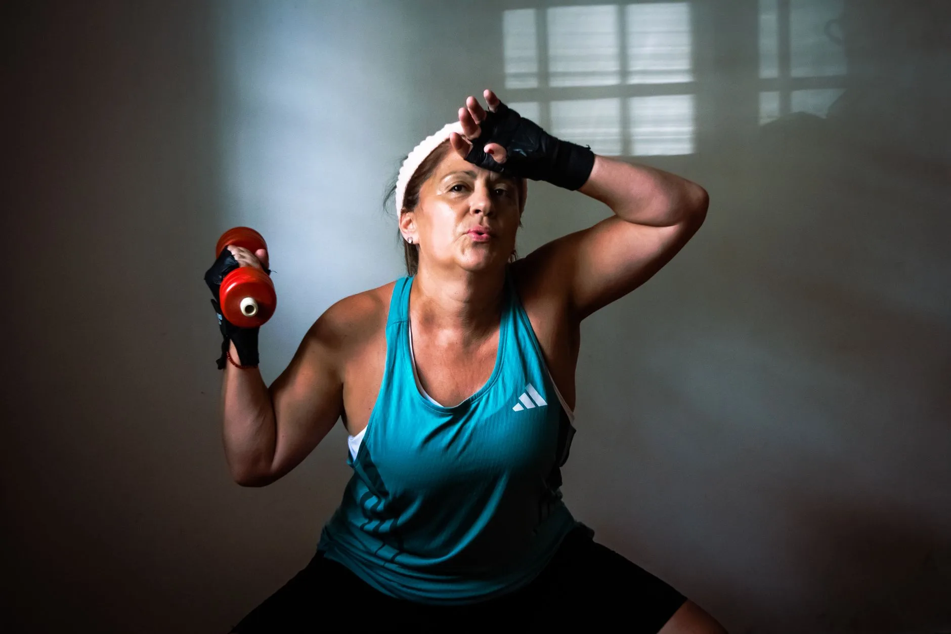 woman doing resistance training with dumbbells