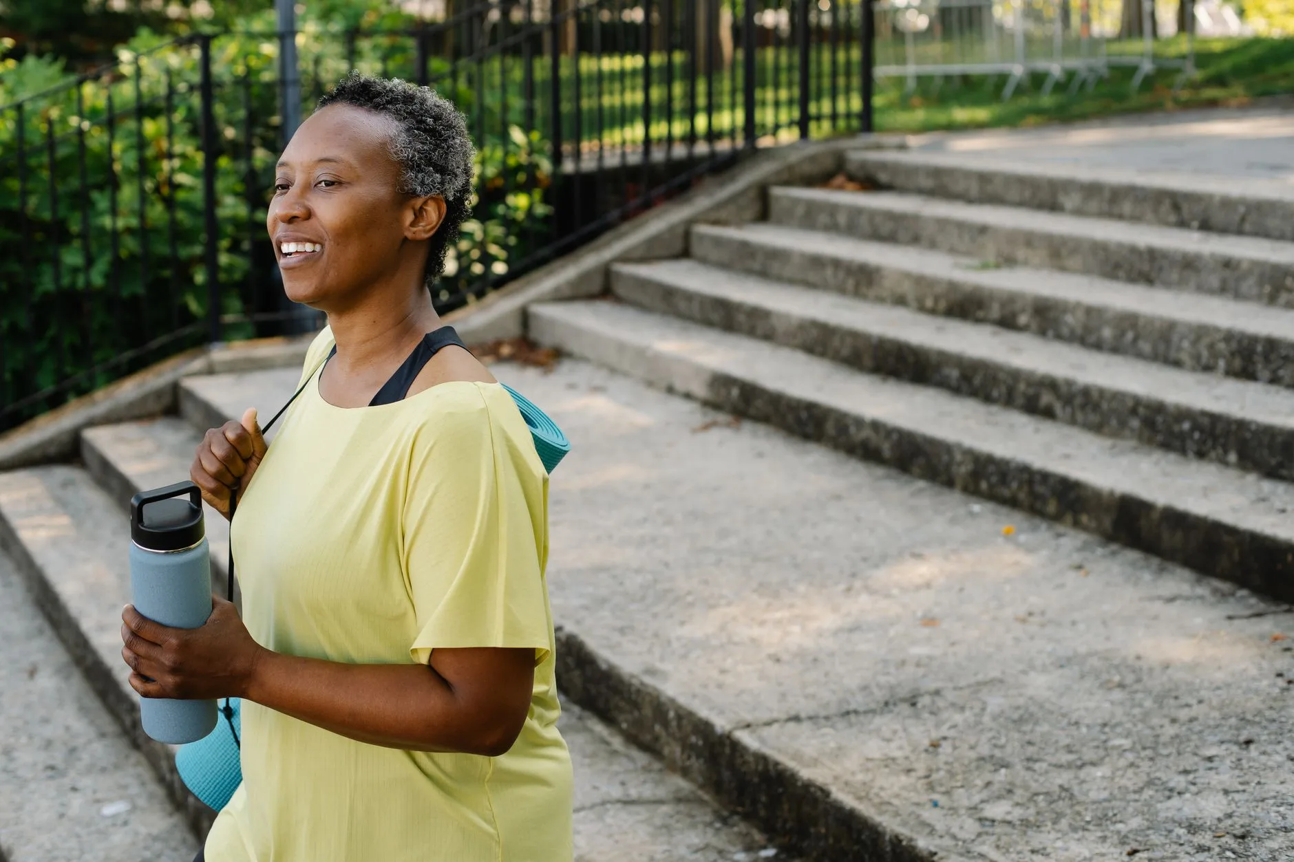 woman over 50 walking outdoors for daily activity metabolism