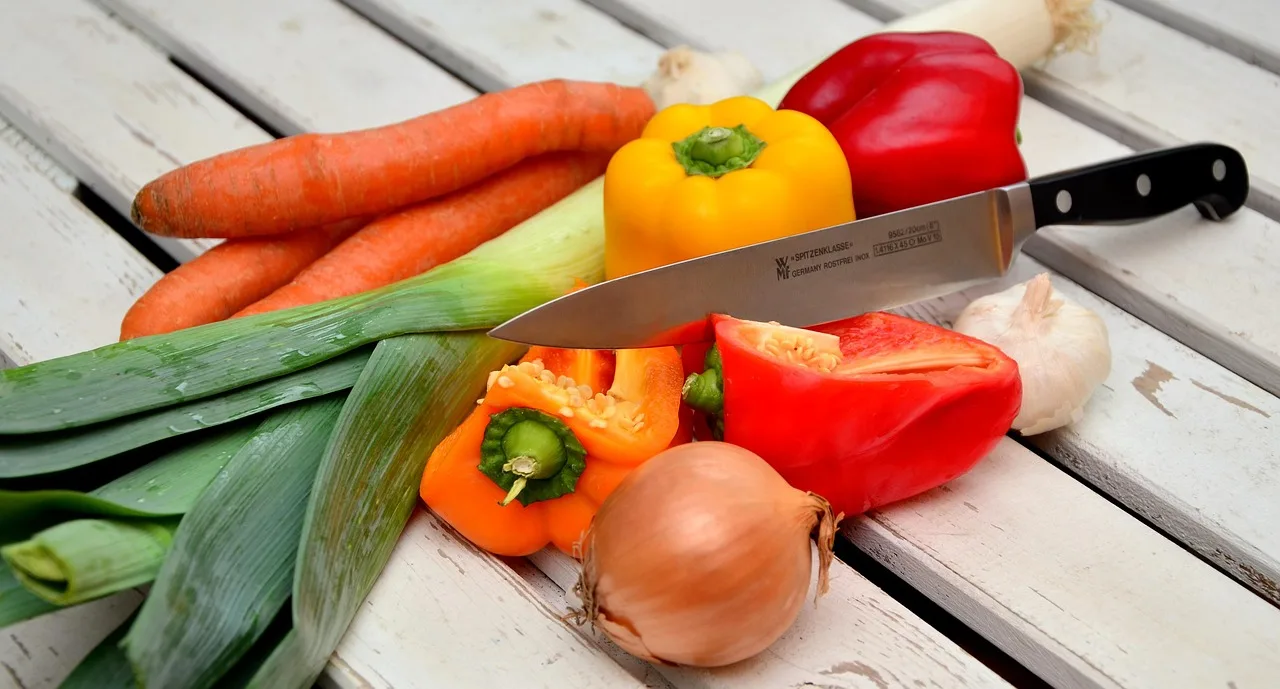 woman over 50 preparing healthy meal for metabolism support