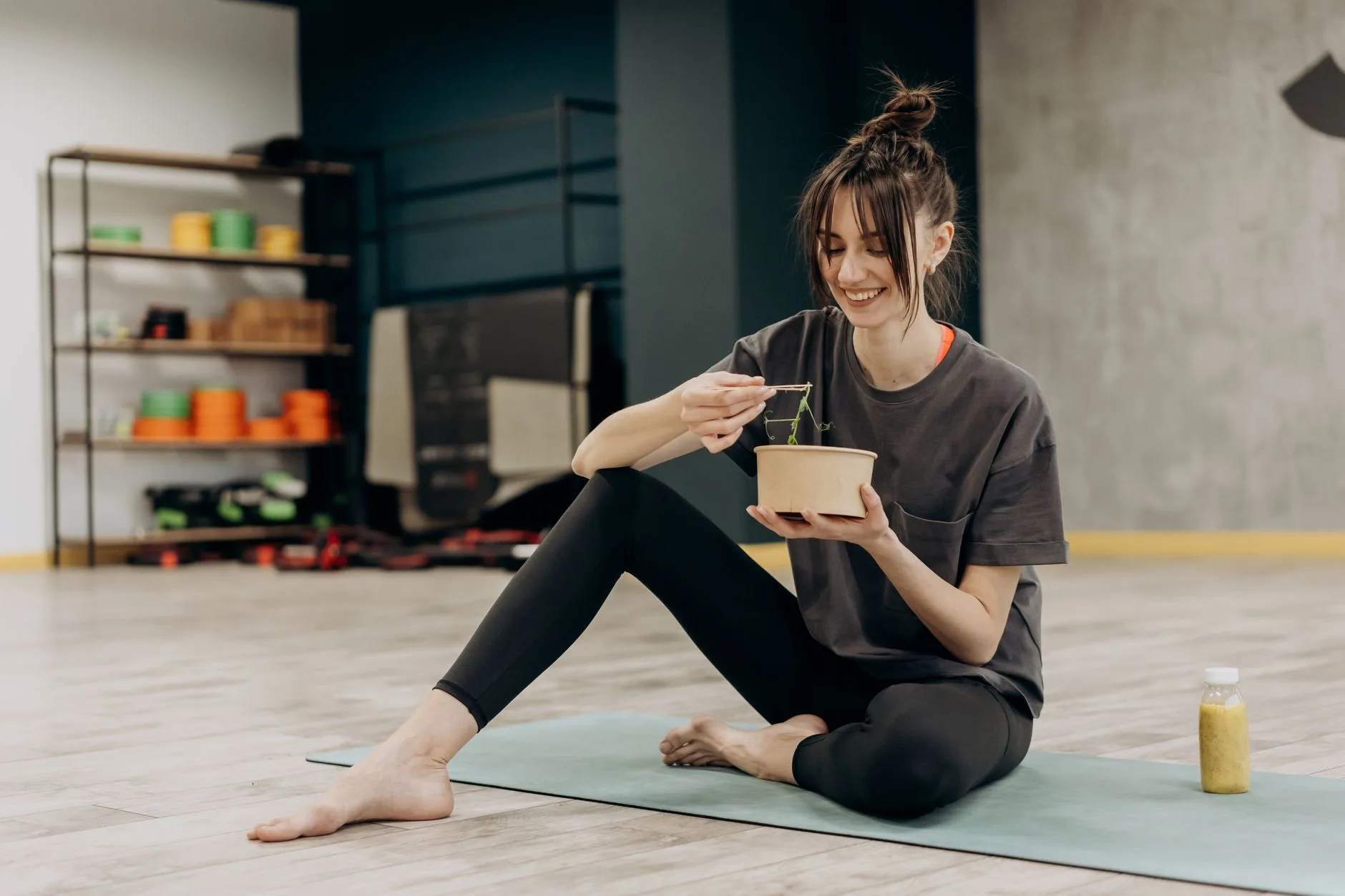 woman feeling full and satisfied after a small healthy meal