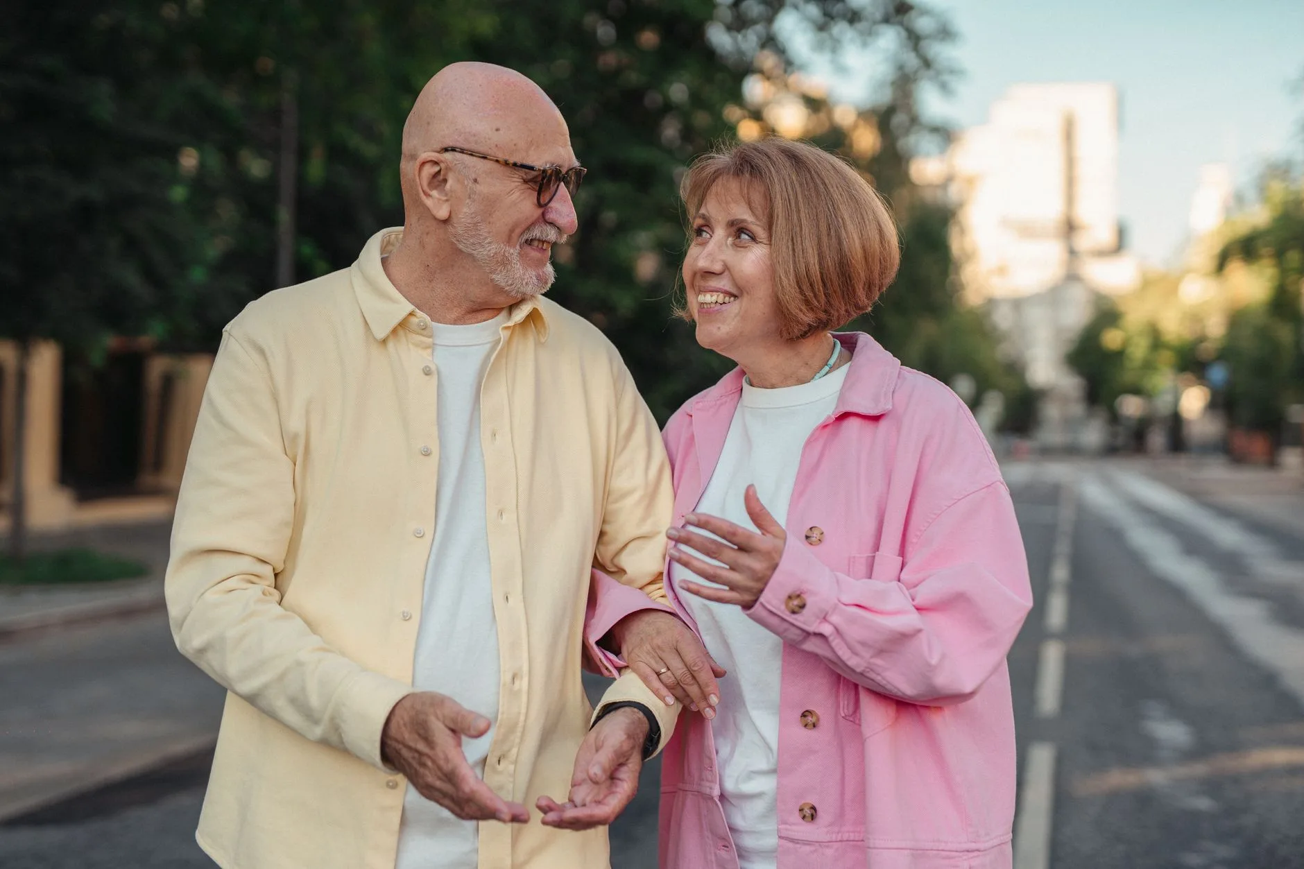 older couple walking outdoors for brain health
