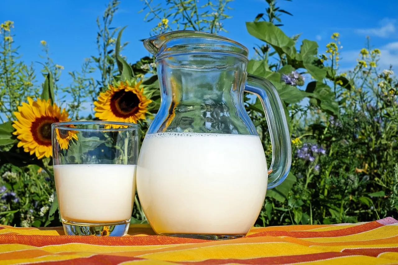 woman over 50 preparing healthy protein drink in kitchen