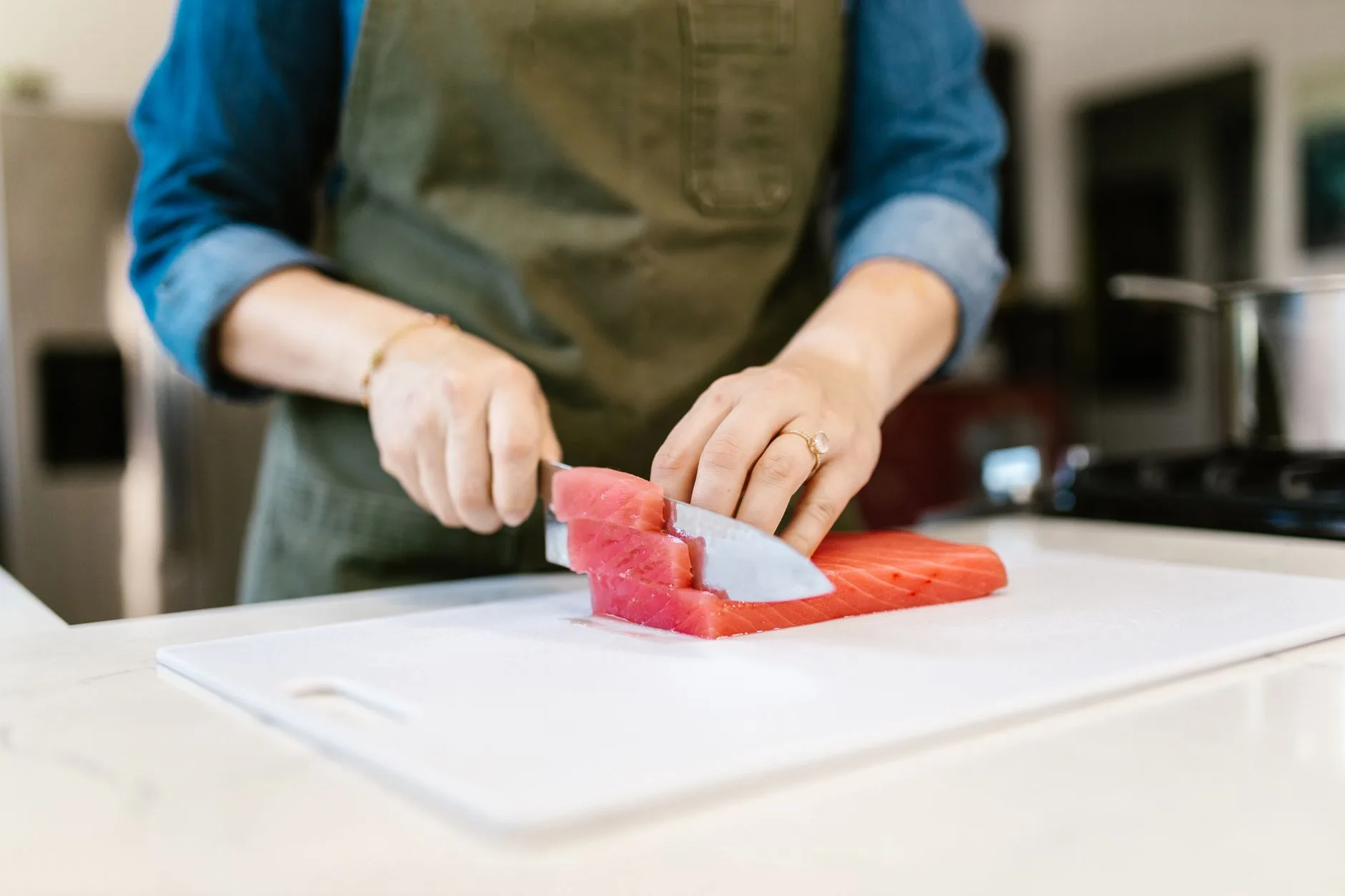 woman over 50 preparing healthy protein meal in kitchen