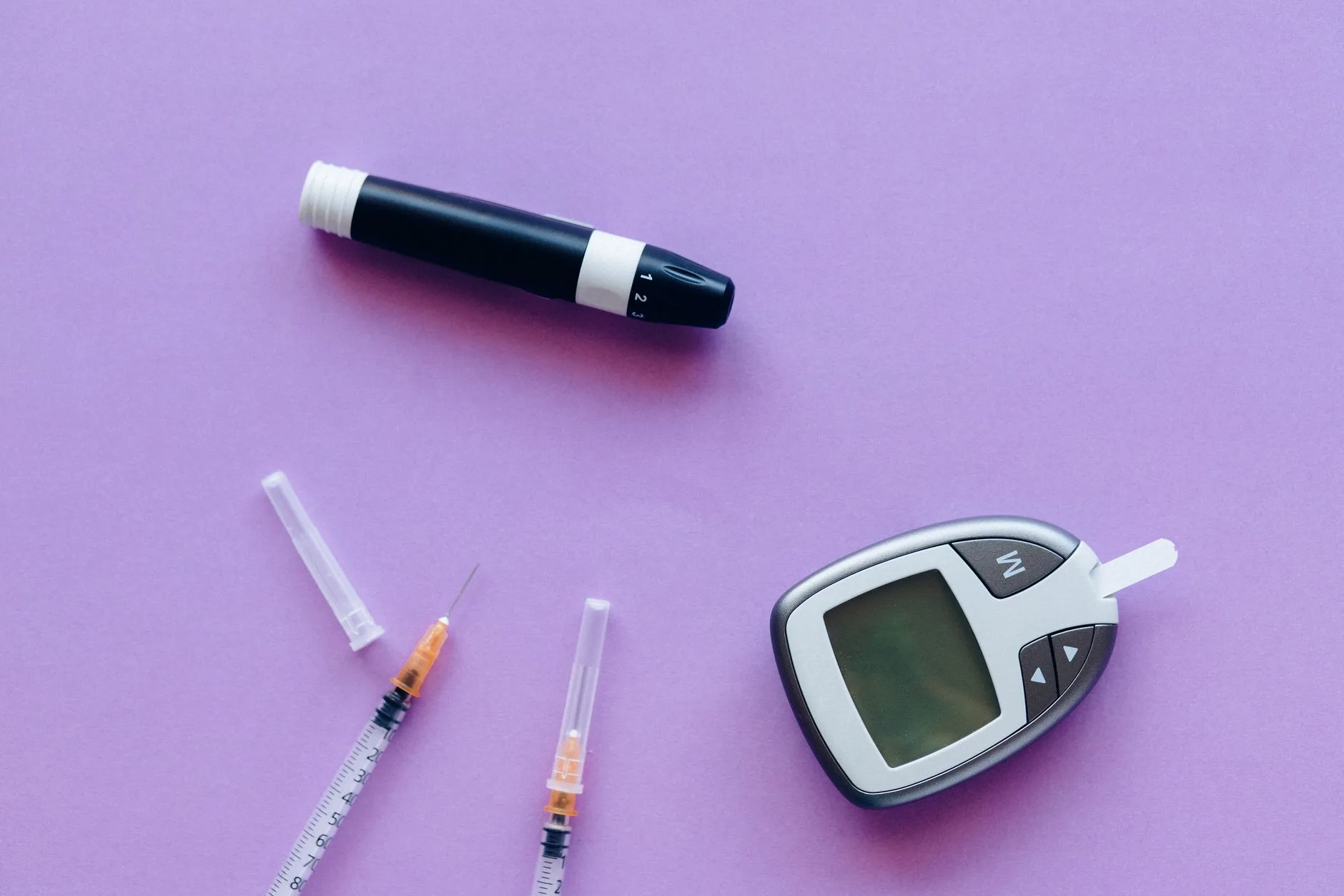 insulin pump and glucose meter on a table