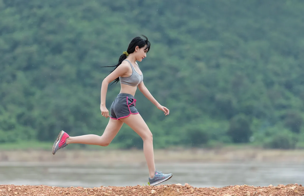 woman performing resistance training to boost natural fat metabolism